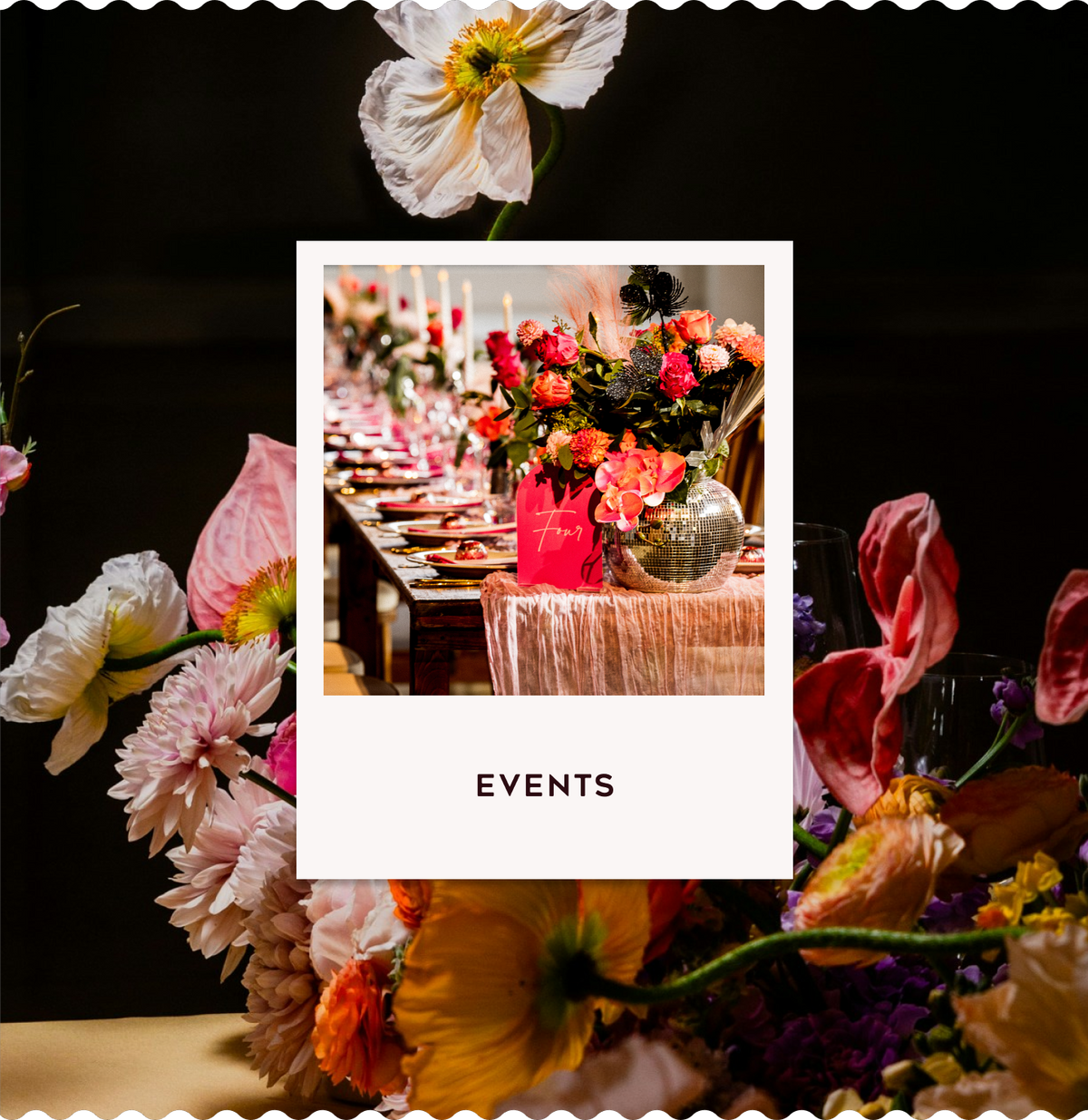 Events card with a floral table display, pink and orange flowers, place settings and a silver disco ball